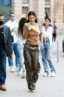 bella-hadid-bronze-dress-one-shoulder-dress-street-style-casual-chic-full-length-single-sleeved-relaxed-fit-paris-2021-bi-co...