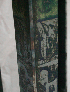  paintings were exposed onto the metal using photographic film, etched using a nitric acid bath, and then turned green during the welding of the legs.