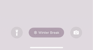 A screenshot of the lock screen that appears on iPhones running iO6 16 with the name of the Focus mode ("Winter Break") emphasized.
