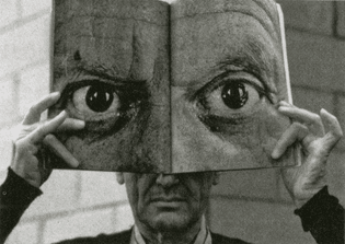 Inge Morath, Charles Eames posing with a Mask of Picasso’s Eyes, 1959