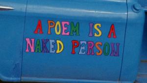 documentary title painted in colorful letters on the side of an old truck's door