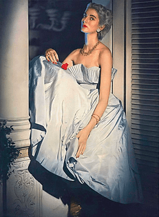 Carmen Dell'Orefice in a short evening dress of romantic iridescent silk taffeta by Ceil Chapman