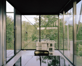 steel-framed-house-with-glass-walls-in-ripanj-by-ten-studio-5.jpg