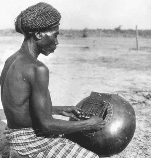 Master player of the Luba instrument chisanzhi cha lungandu, Nothern Angola 1960s