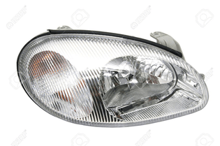 13599883-new-car-headlights-on-a-white-background.jpg