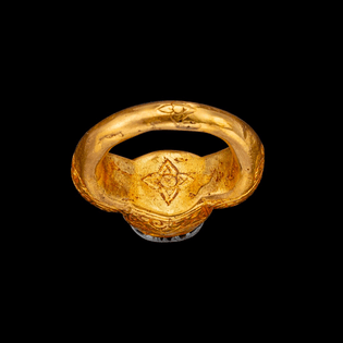 A gold and red-gem repoussé ring Champa, 14th century