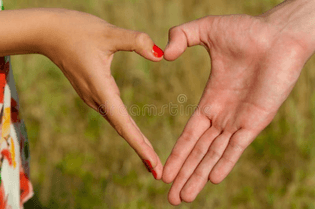 hands-folded-pair-heart-shaped-nature-43480267.jpg