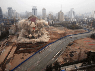 the-former-city-hall-of-kunming-china-is-brought-down-with-a-controlled-demolition-.jpg