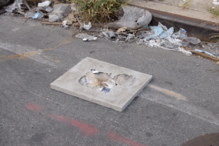 Coral Saucedo Lomelí, Trash tiles, 2020, found flat trash, and concrete. 3.5ft x 1ft x 3ft.