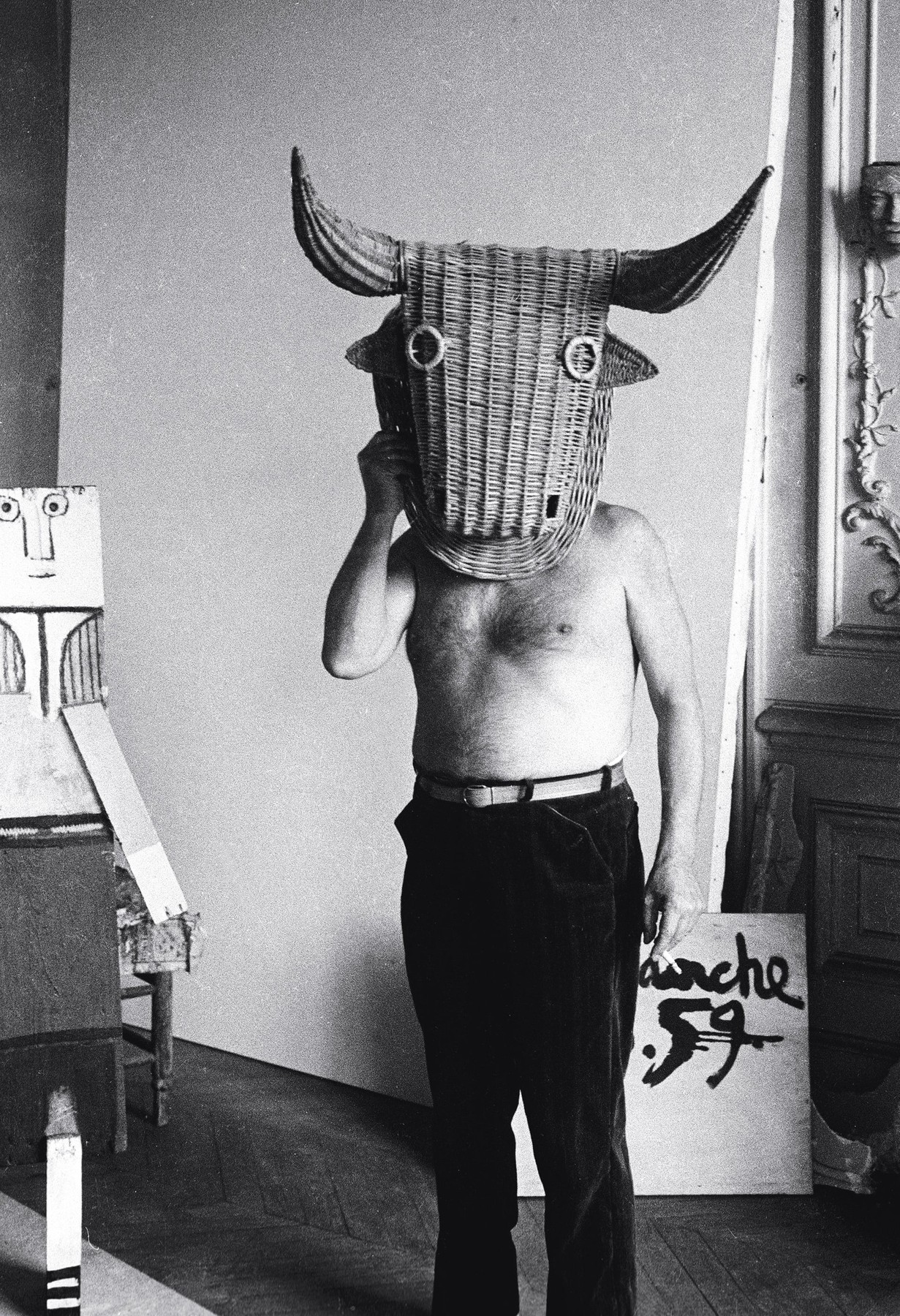 Edward Quinn, Picasso wearing a bull’s head intended for bullfighter's training, La Californie, Cannes, 1959.