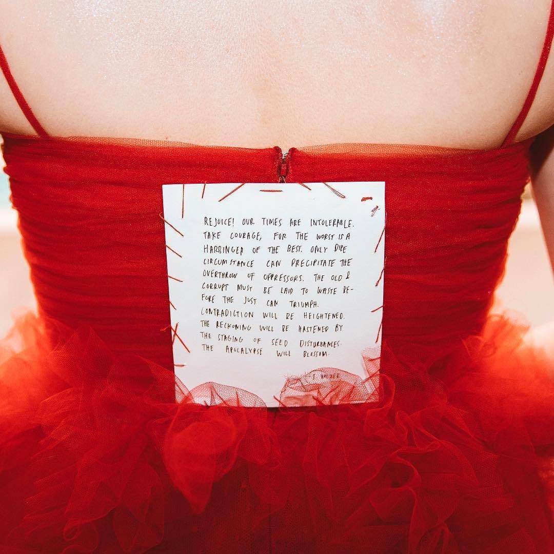 sewn-into-the-back-of-lorde_s-grammy-dress-rejoice-our-times-are-intolerable-by-jenny-holzer.jpg