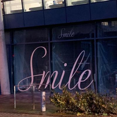 photo capturing the phrase, smile twice :) :)
