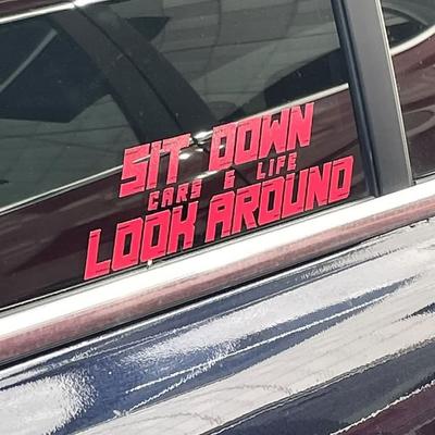 photo capturing the phrase, sit down cars & life look around