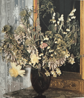 Amethyst colored vase mirror console with white, cream and pink flowers: sweet william, lamb's ears, funkia, deutzia, false jasmine, peonies, Japanese peonies, flowering ground elder and flowering leek