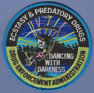 "Dancing with darkness" - DEA badge