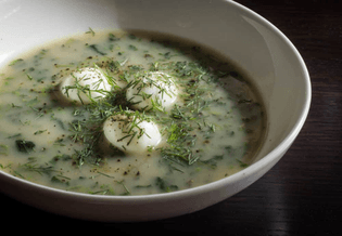 Stinging nettle soup or Nasselsoppa: a classic Scandinavian spring recipe garnished with dill and eggs