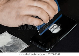 addict-uses-drugs-using-mobile-450w-632805362.jpg