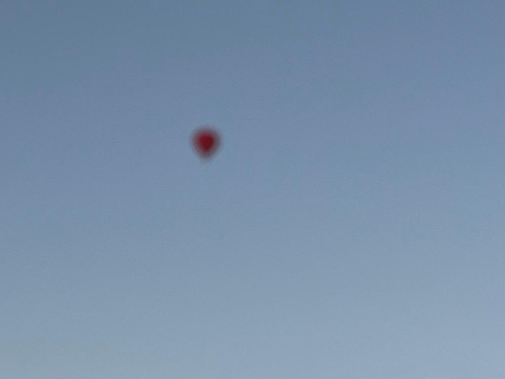 Attempted photo of a red hot air balloon over Melbourne City