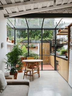 a-steel-and-glass-structure-wraps-one-end-of-the-apartment-adding-the-illusion-of-greater-space-to-the-720-square-foot-home-...