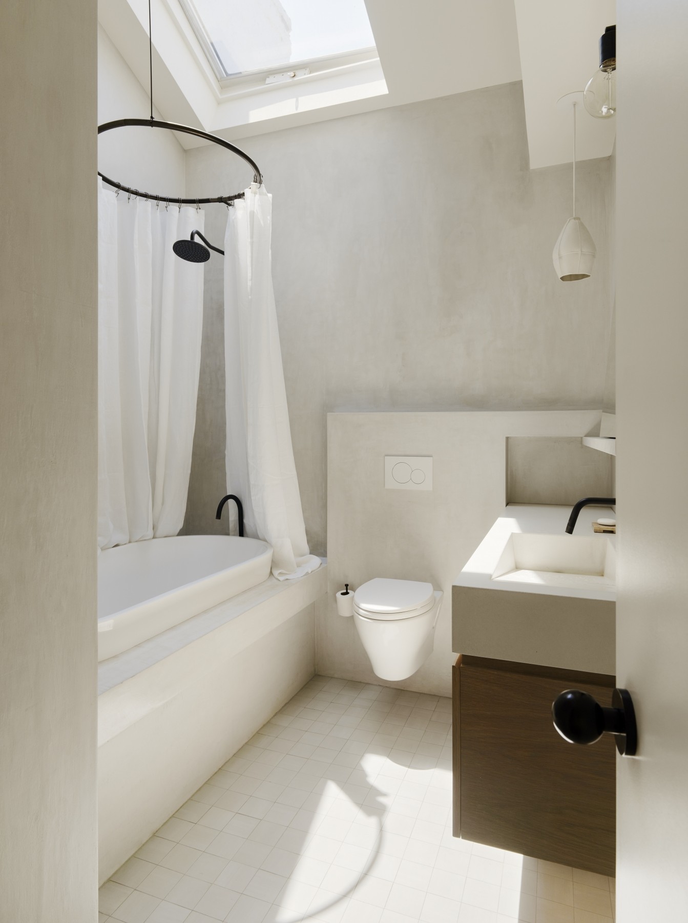 white-concrete-finish-bathroom-with-skylight-brooklyn-1466x1965.jpg