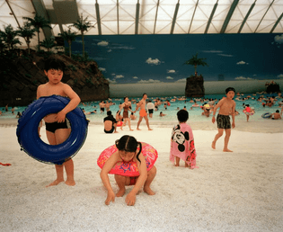  Martin Parr JAPAN. Miyazaki. Seagaia Ocean Dome. The Artificial beach inside the Ocean Dome. 1996